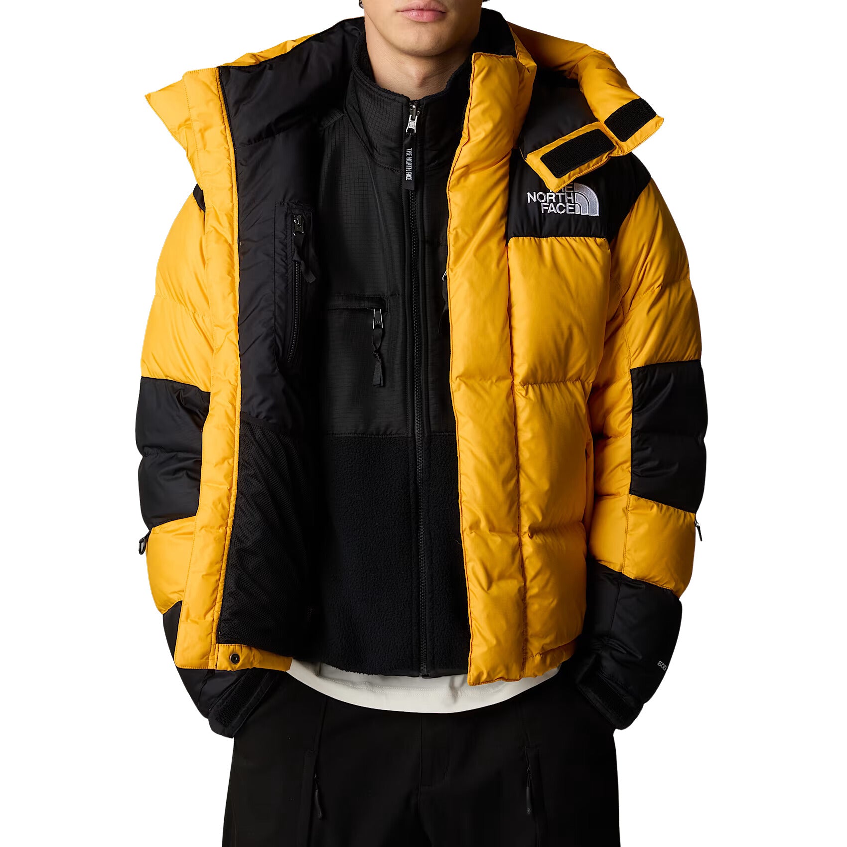 Hombre con la Chaqueta The North Face HMLYN Baltoro Amarilla abierta