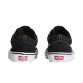 Vans Old Skool Black White vista lateral interior con Sidestripe blanca, upper negro y suela blanca vulcanizada.
