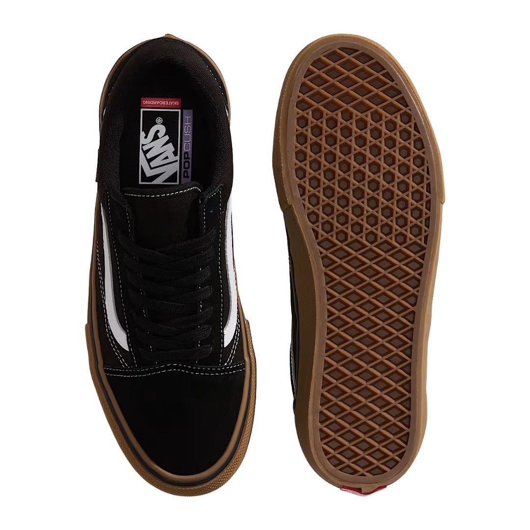Vans Skate Old Skool negra: vista superior del zapato junto a su suela de goma gum con dibujo gofrado antideslizante, mostrando el insole POPCUSH y el sistema de cordones clásico.