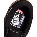 Vans Skate Old Skool negra: vista interior de la zapatilla mostrando la etiqueta Vans con tecnología de amortiguación POPCUSH y el logo 