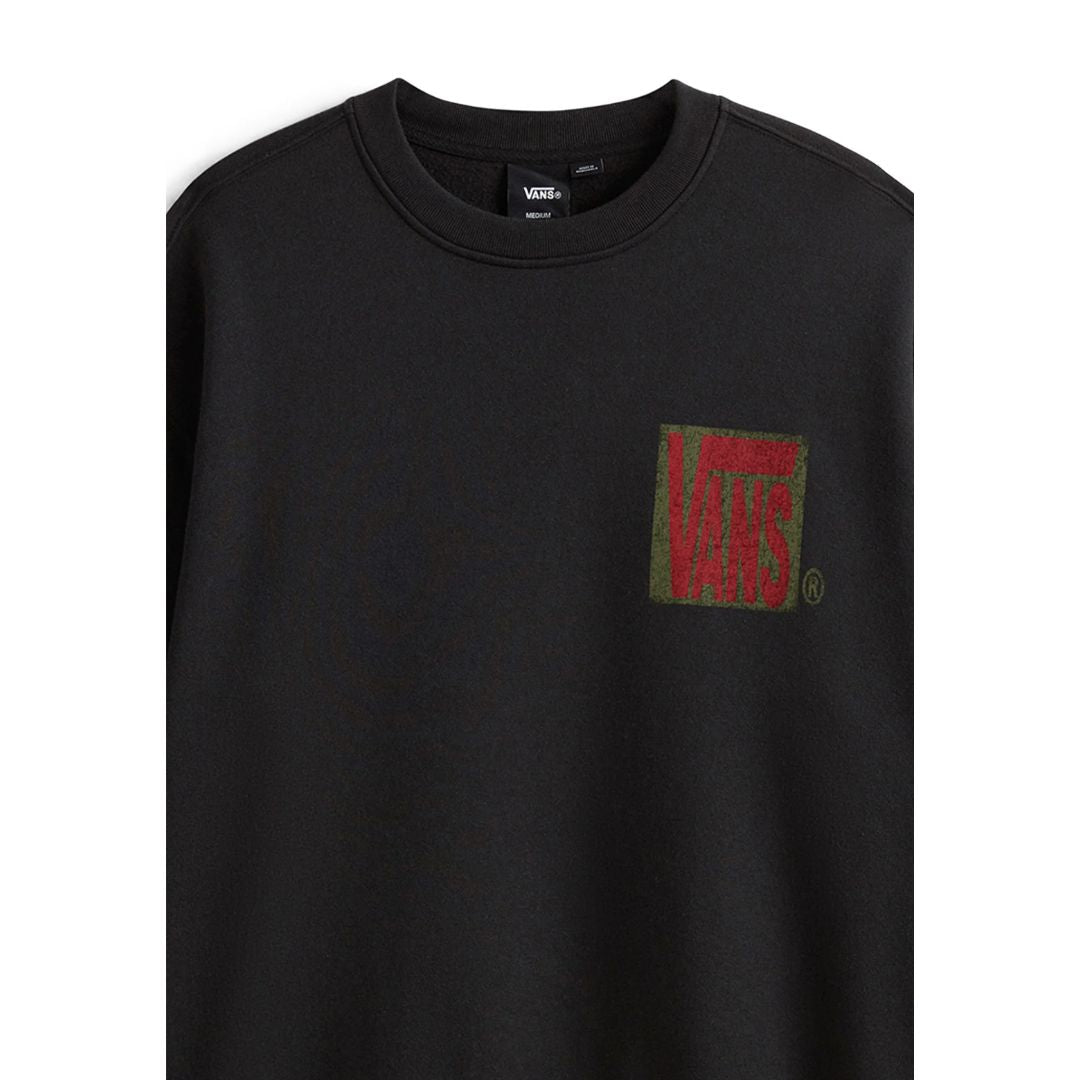 Detalle frontal de la Vans Stretch Stack Crackle Crew negra, sudadera cuello redondo con estampado Vans efecto crackle en el pecho.