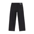 Pantalón vaquero Volcom Billow Denim en negro fotografiado en plano cenital, mostrando el corte completo, los bolsillos traseros y los detalles Volcom característicos.