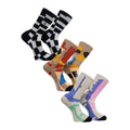 Los tres pares del pack Volcom Carrau Print Mixer Sock colocados en diagonal, con los estampados blanco y negro, terracota y pastel del artista Antonio Carrau.