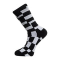 Calcetín Volcom Carrau Print Mixer Sock en estampado geométrico blanco y negro, vista de perfil mostrando el patrón de bloques irregulares tipo puzle.
