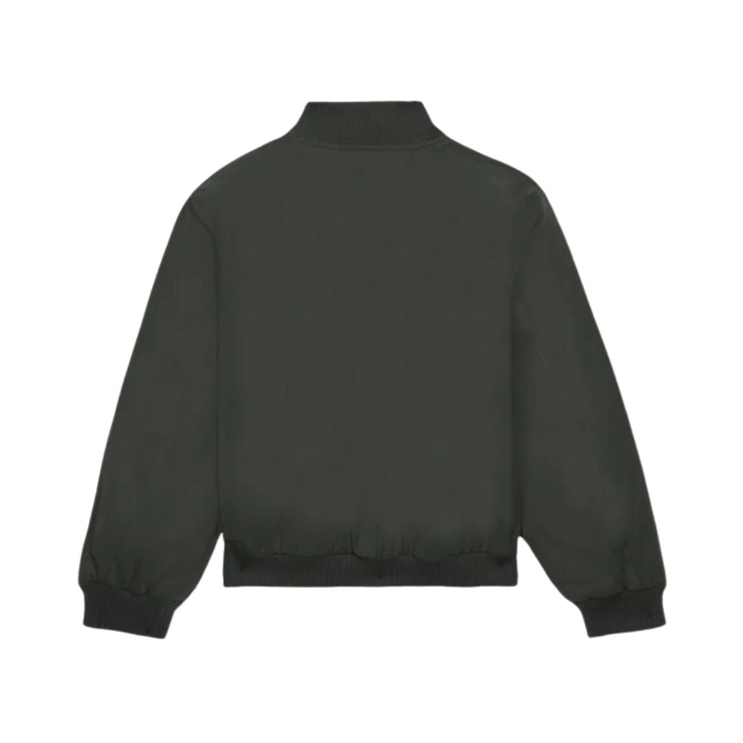 Chaqueta Volcom Damerman en color negro lavado fotografiada en plano de producto sin modelo, vista trasera mostrando el cuello alto y el corte relaxed.