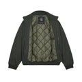 Chaqueta Volcom Damerman en color negro lavado fotografiada en plano de producto, vista trasera abierta mostrando el forro interior acolchado y la etiqueta Volcom.