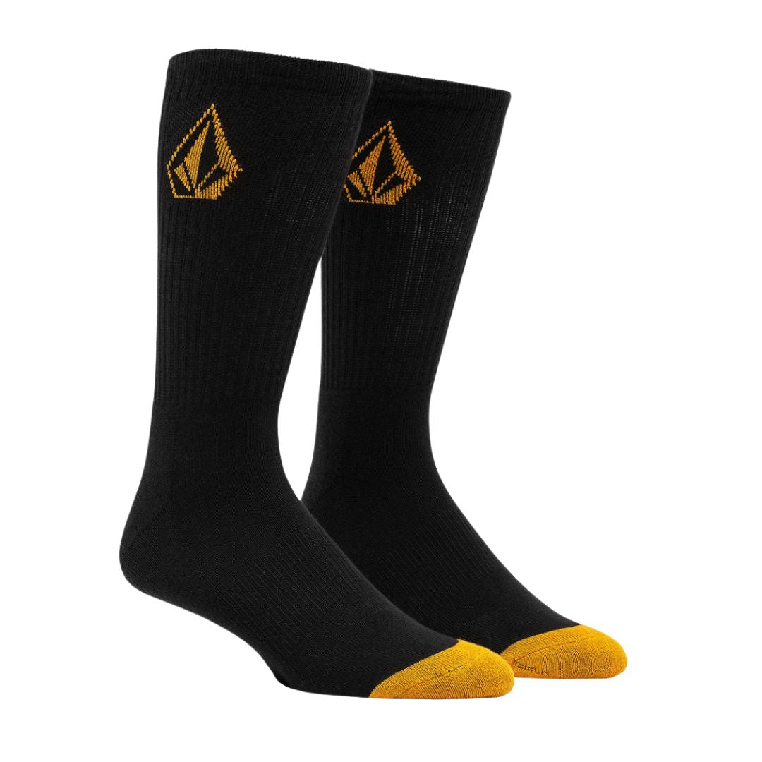 Par de calcetines Volcom Full Stone negros con puntera amarilla y logo bordado en caña.