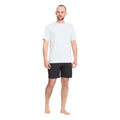 Volcom Lido Solid Mod 18 negro look completo con camiseta técnica.