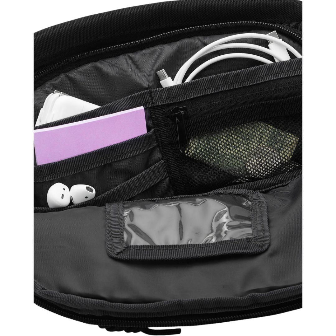 Volcom Waisted Pack negra vista superior con doble compartimento con cremallera.